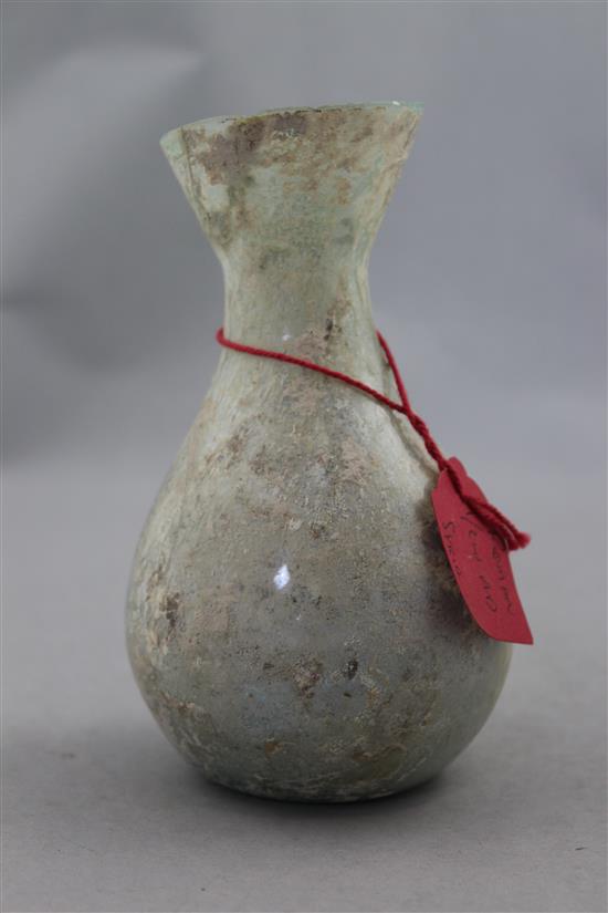 An Islamic glass bottle shaped vessel, c.400 AD, 15cm, cracks